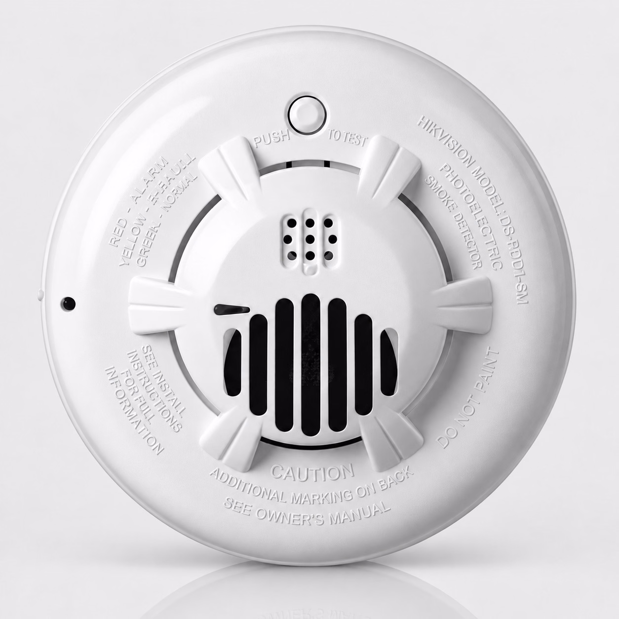 Round white alarm detector with front vents and test button