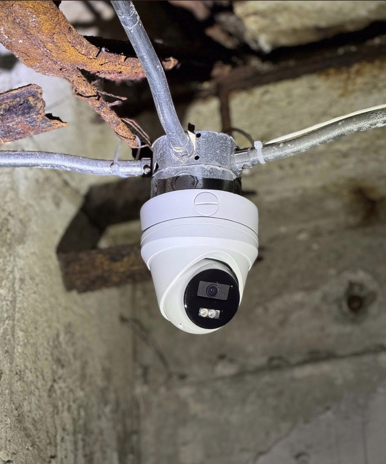 Commercial security cameras covering entrances, parking areas, and delivery points
